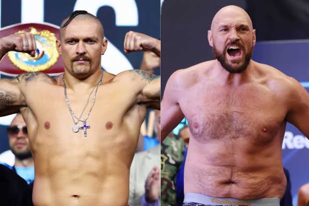 Fury et Usyk sur le ring, prêts pour un combat d'unification des ceintures de boxe.