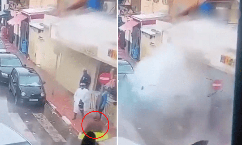 L'homme à la veste marron explose au moment où le policier se tourne vers lui.